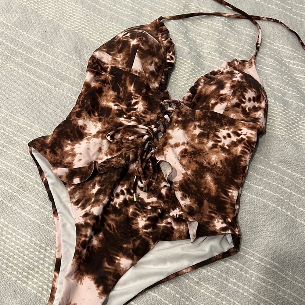 NEVER WORN Sexy brown lace up one piece. Size M